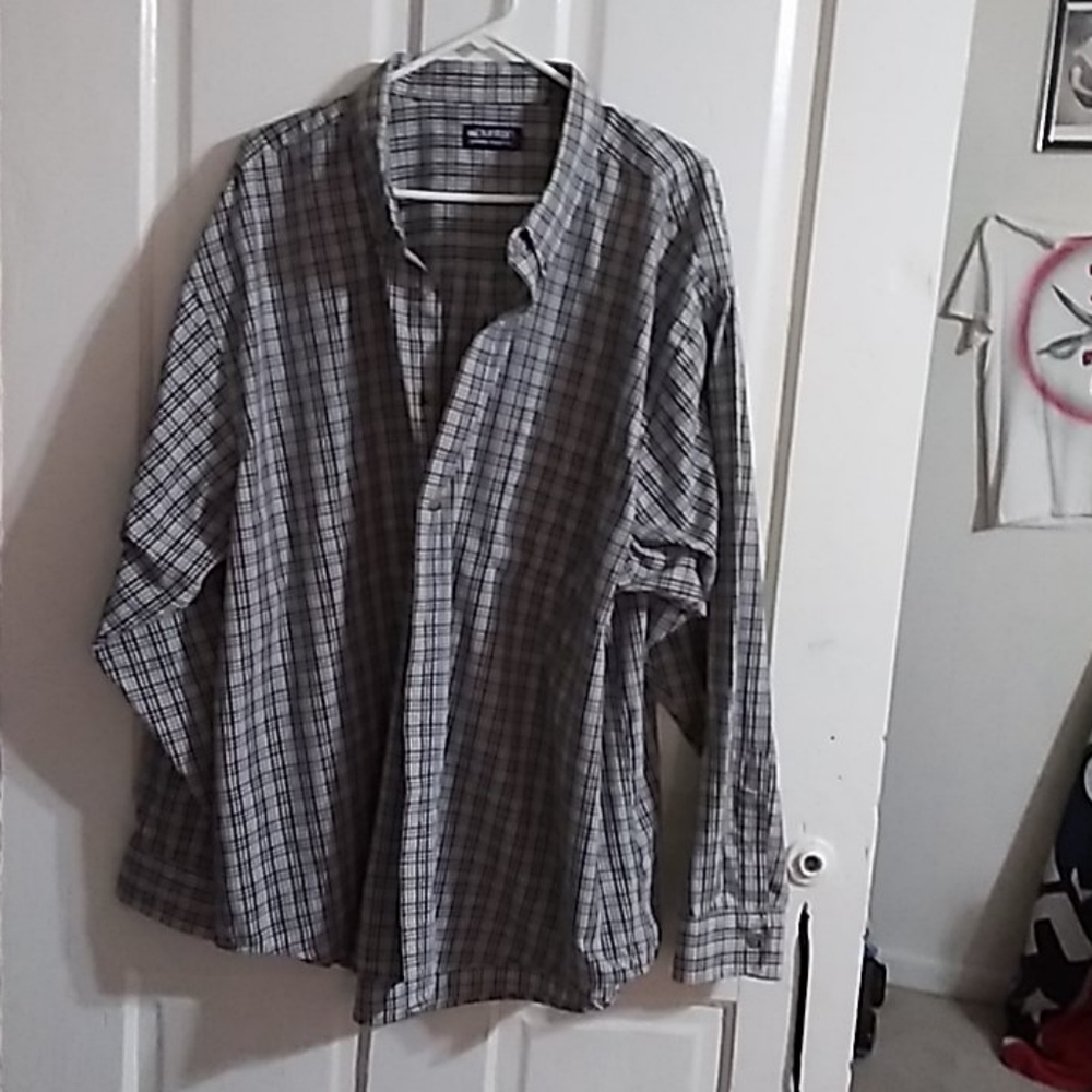 Man striping button up shirt